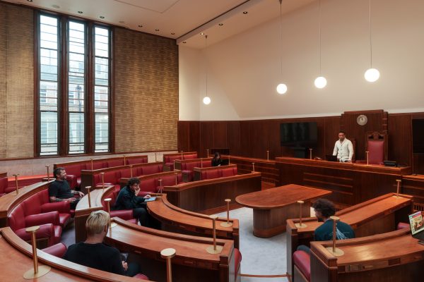 People are shown hosting an event at Hornsey Town Hall in the restored council chamber.